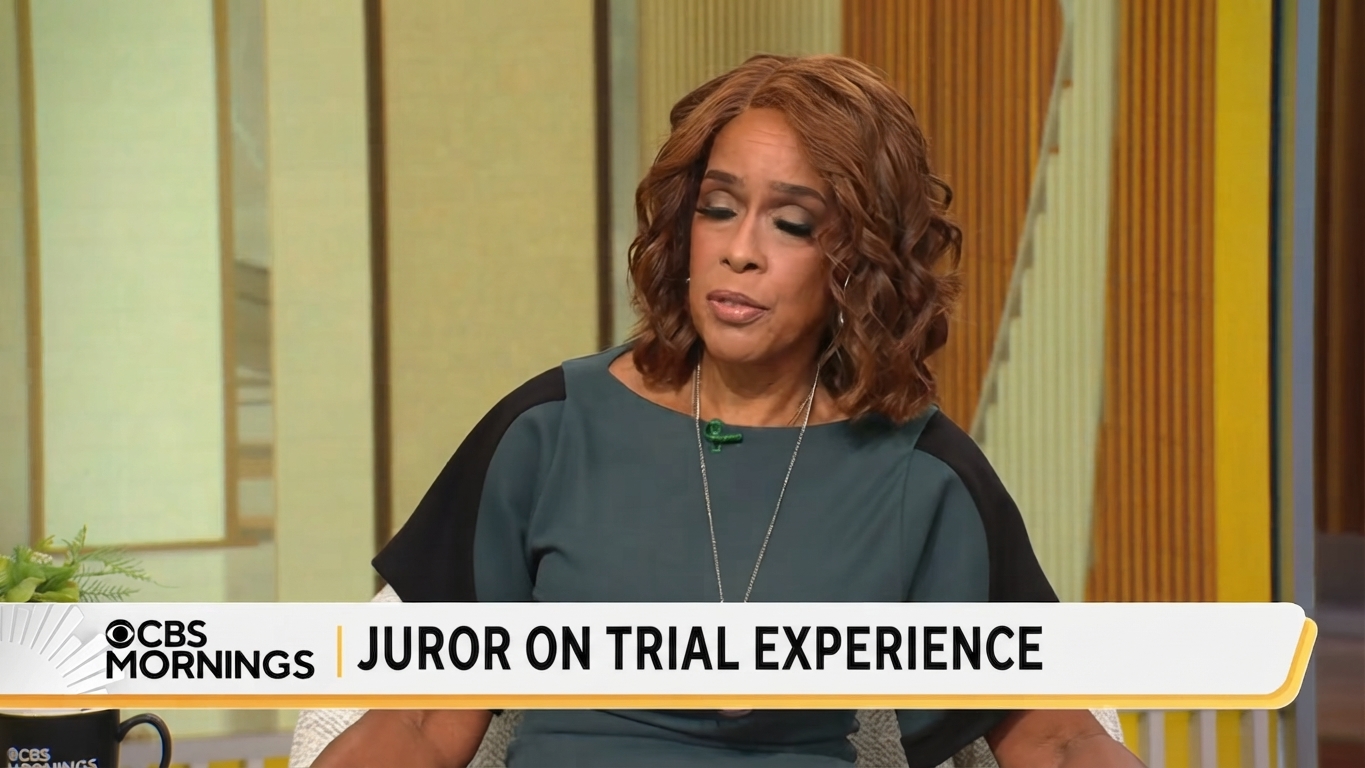 Host Gayle King holding her hands open with a perplexed expression after hearing the juror speak