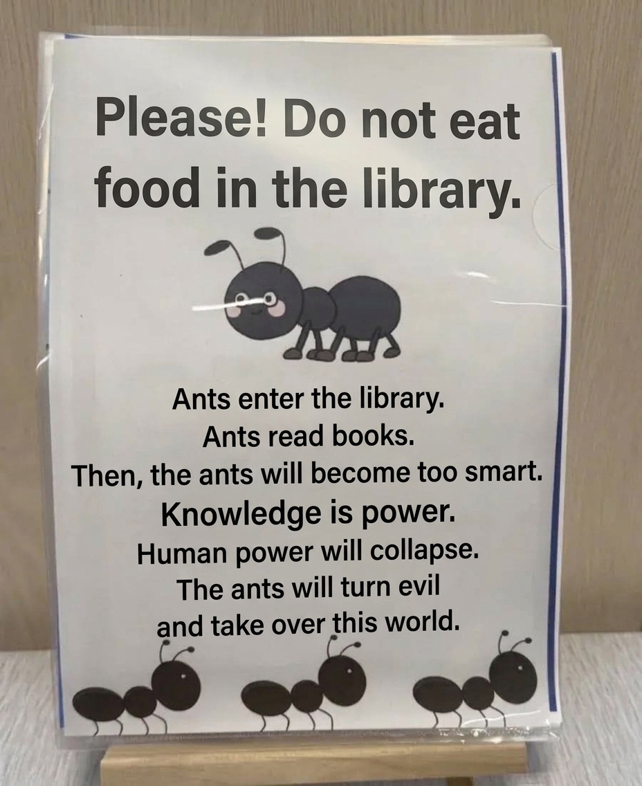 A humorous sign warning that bringing food into the library will attract ants, who will read books, gain knowledge, and eventually take over humanity.