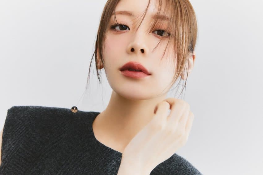 A female model with bangs looking straight ahead