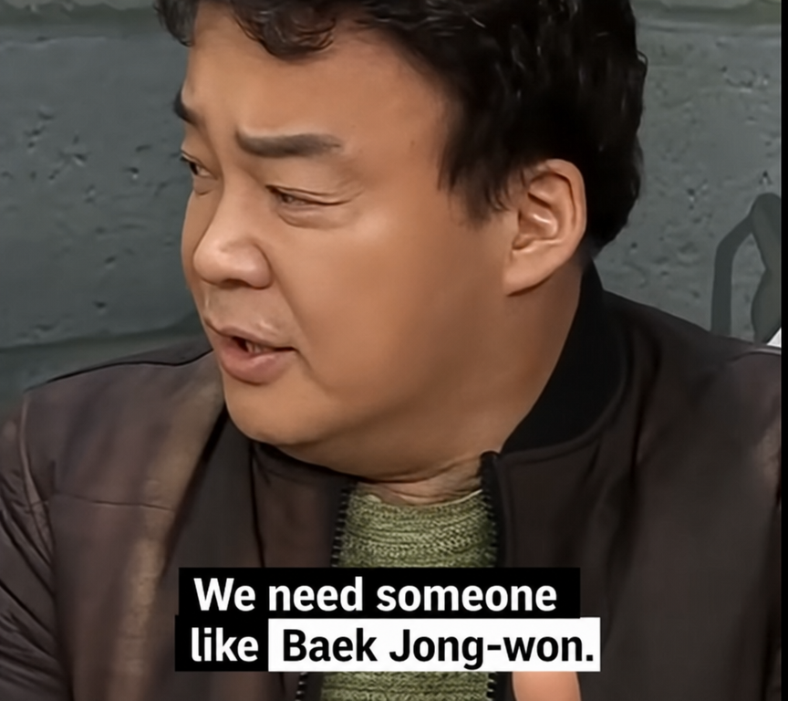 A meme of Baek Jong-won wearing a blue sweatshirt, hand on his chest, looking confident with a subtitle saying 'It's me, Baek Jong-won!'.