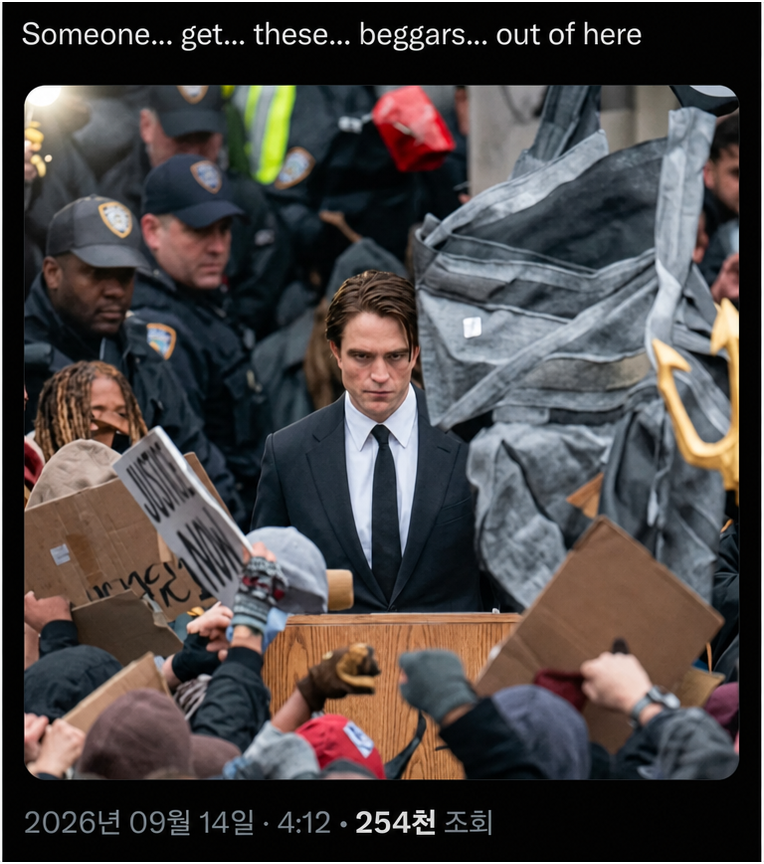 Robert Pattinson in a suit standing behind a podium with a stern expression, surrounded by protesters and police