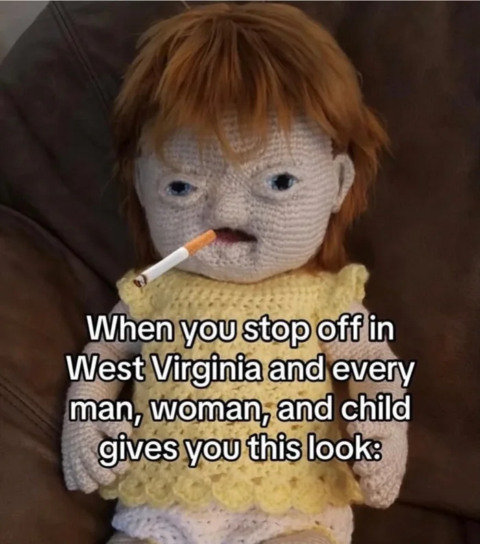 Crocheted doll with ginger hair, wide-set eyes, and a cigarette in its mouth with caption about stopping in West Virginia