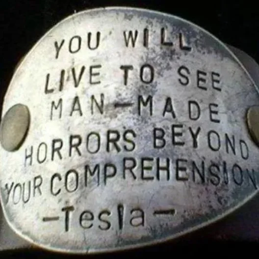 A close-up of a stamped metal plate reading: YOU WILL LIVE TO SEE MAN-MADE HORRORS BEYOND YOUR COMPREHENSION -Tesla-