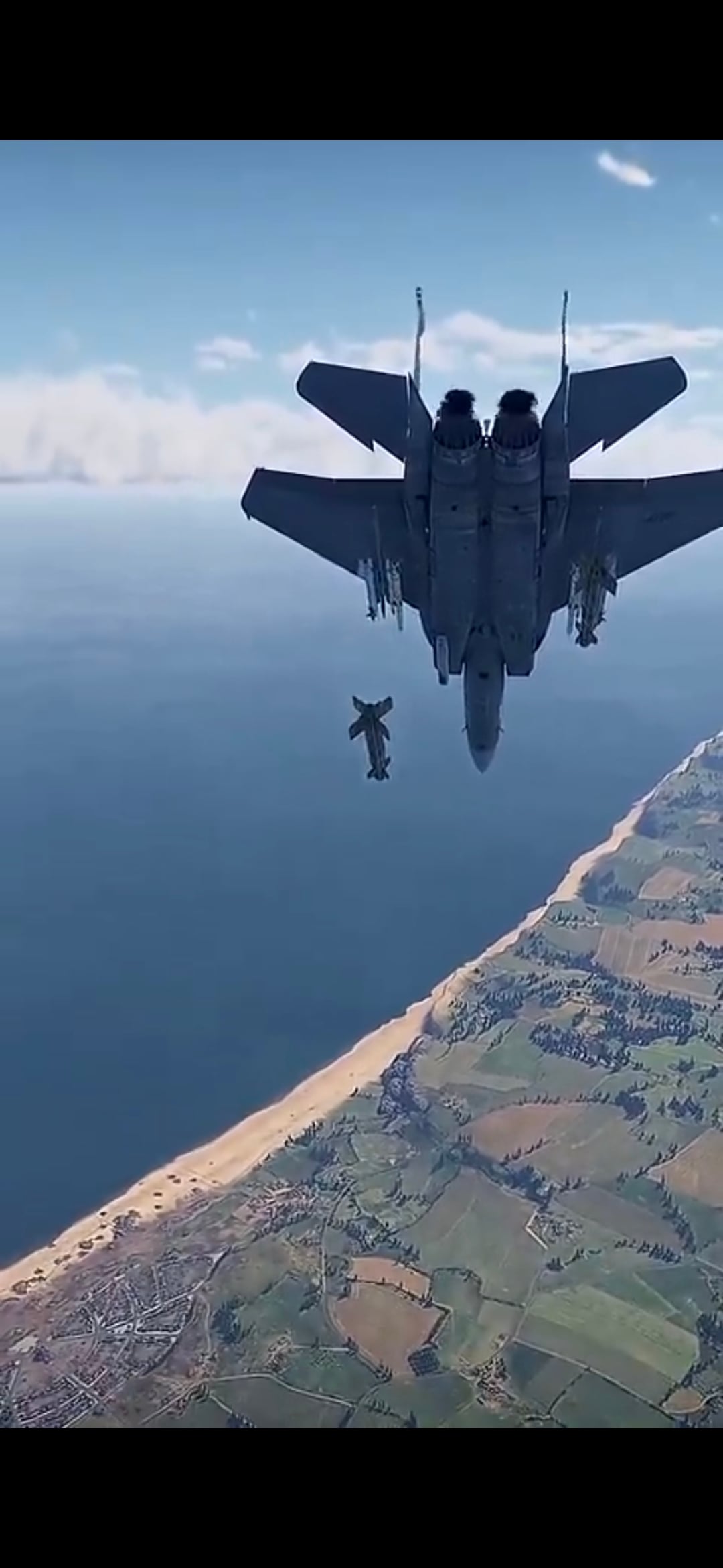 戦闘機が海岸上空から急降下しながら爆撃を行うゲーム内のシーン