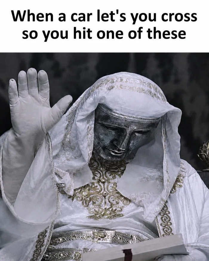 Meme showing King Baldwin IV in white robes and a mask raising his hand in acknowledgment, captioned about waving when a car lets you cross.