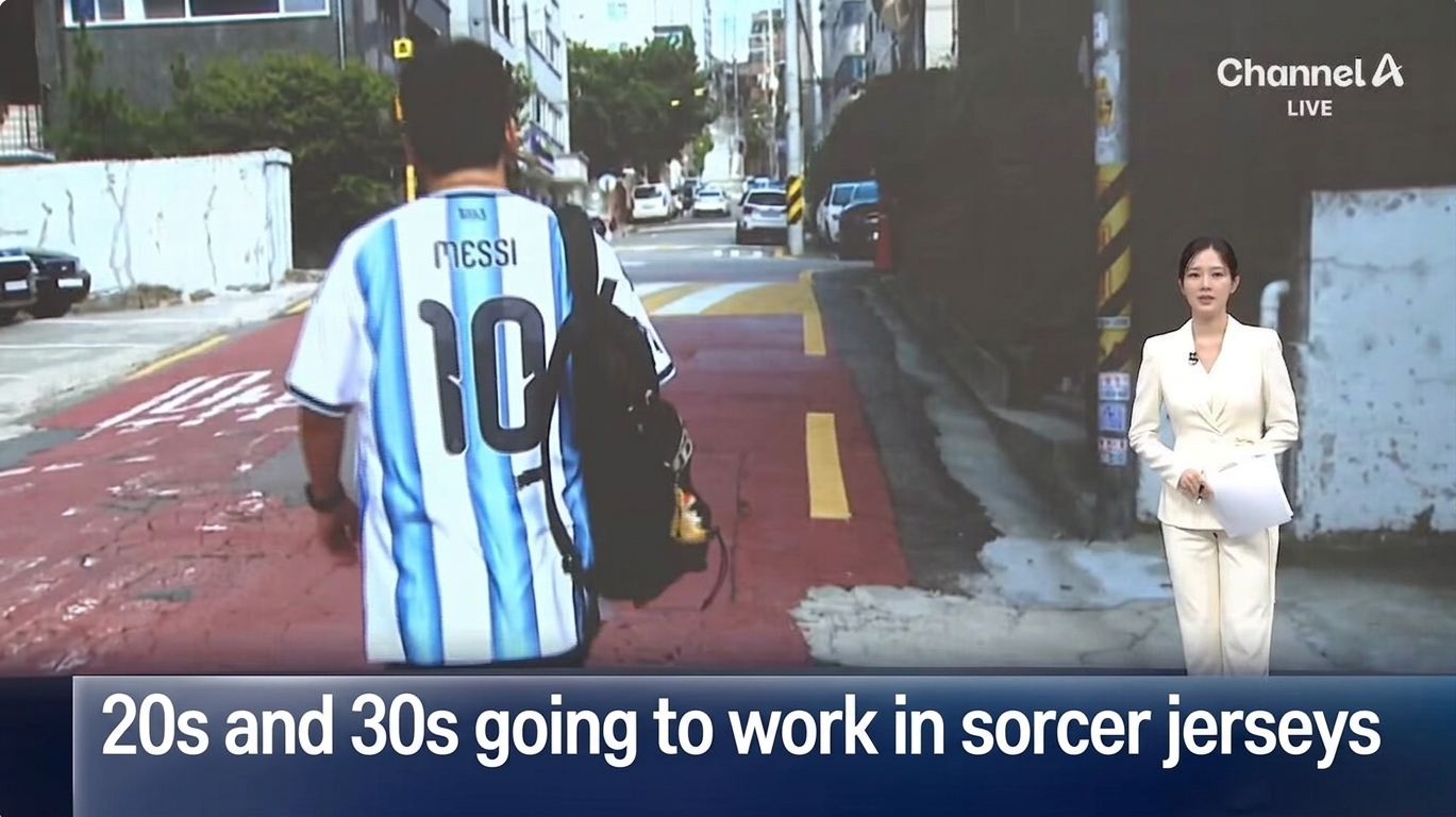 Channel A news screen reporting on 20-30 year olds going to work wearing soccer jerseys