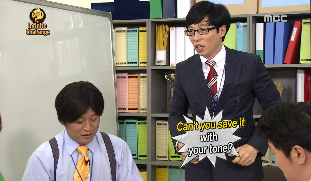 A scene from Infinite Challenge where Yoo Jae-suk asks, 'Can't you save it with your tone?'