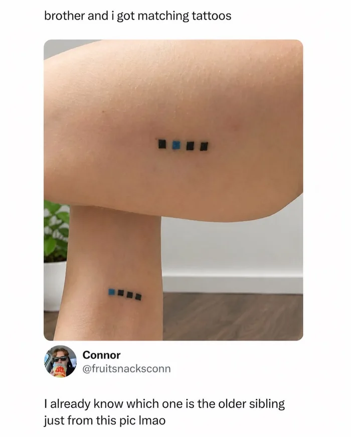 A photo of two siblings showing matching tattoos of four squares resembling controller player indicators, where one has the second square colored blue and the other has the first square blue, with a comment noting it's obvious who the older sibling is.