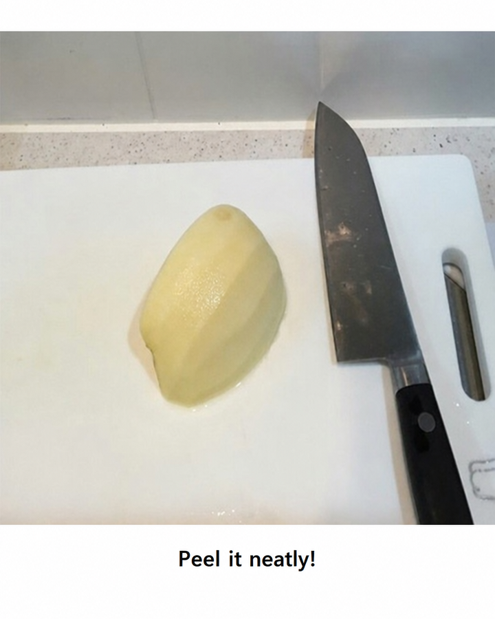 A photo of a peeled apple slice and a kitchen knife on a cutting board, with the text 'Peel it neatly!' at the bottom.