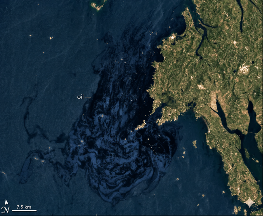 Satellite photo of the sea off the coast of Taean clearly showing a giant black oil spill spreading.