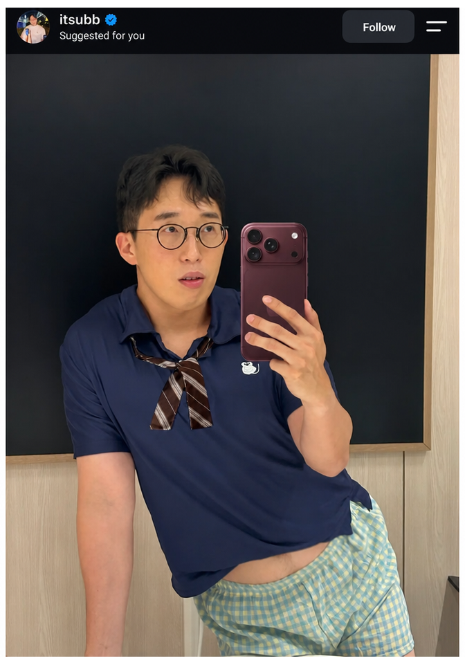 YouTuber ITSub parodying Rosé's mirror selfie outfit and pose, wearing a blue polo shirt with a ribbon tie and plaid pajamas while taking a selfie in the mirror.