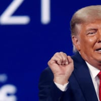 Left split shot of Donald Trump's upper body making his signature dancing move with clenched fists against a blue background