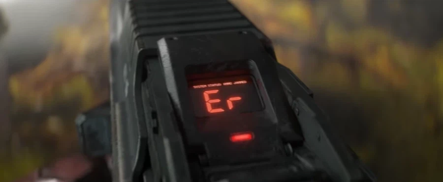 Close-up of a firearm's top display showing an 'Er' error code in red digital characters