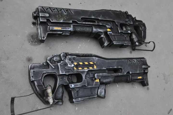Two exquisitely reproduced, life-sized prop models of the StarCraft C-14 Impaler Gauss Rifle.