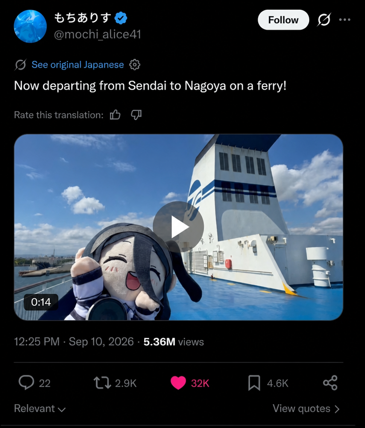Twitter screenshot of a Blue Archive Tendou Alice plushie posing on a ferry deck with the ocean in the background.