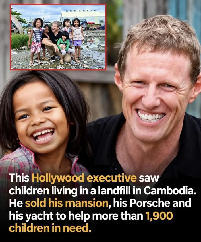 A smiling former Hollywood executive pictured alongside children in Cambodia.