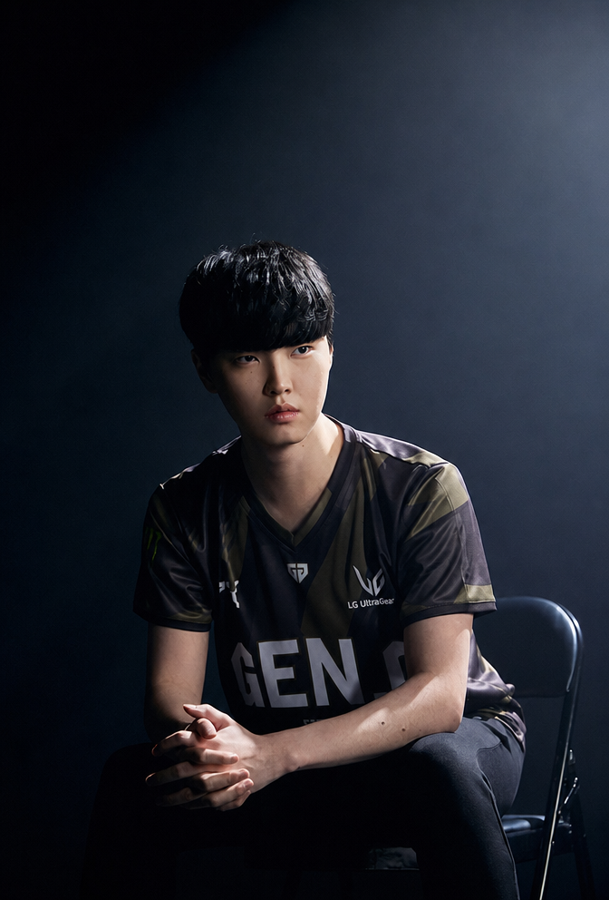 Profile photo of Chovy sitting in a chair wearing a Gen.G uniform, staring straight ahead.
