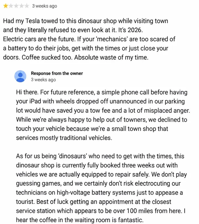 A 1-star review by a Tesla owner complaining a rural repair shop refused service, followed by the owner's response explaining safety limits and calling the car an iPad with wheels.