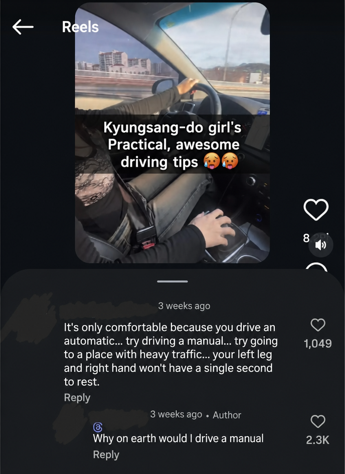 A screenshot of a driving Reel video and comments. A commenter gives unsolicited advice saying, 'It's only comfortable because you drive an automatic. Try driving a manual.' The creator replies, 'Why on earth would I drive a manual?'