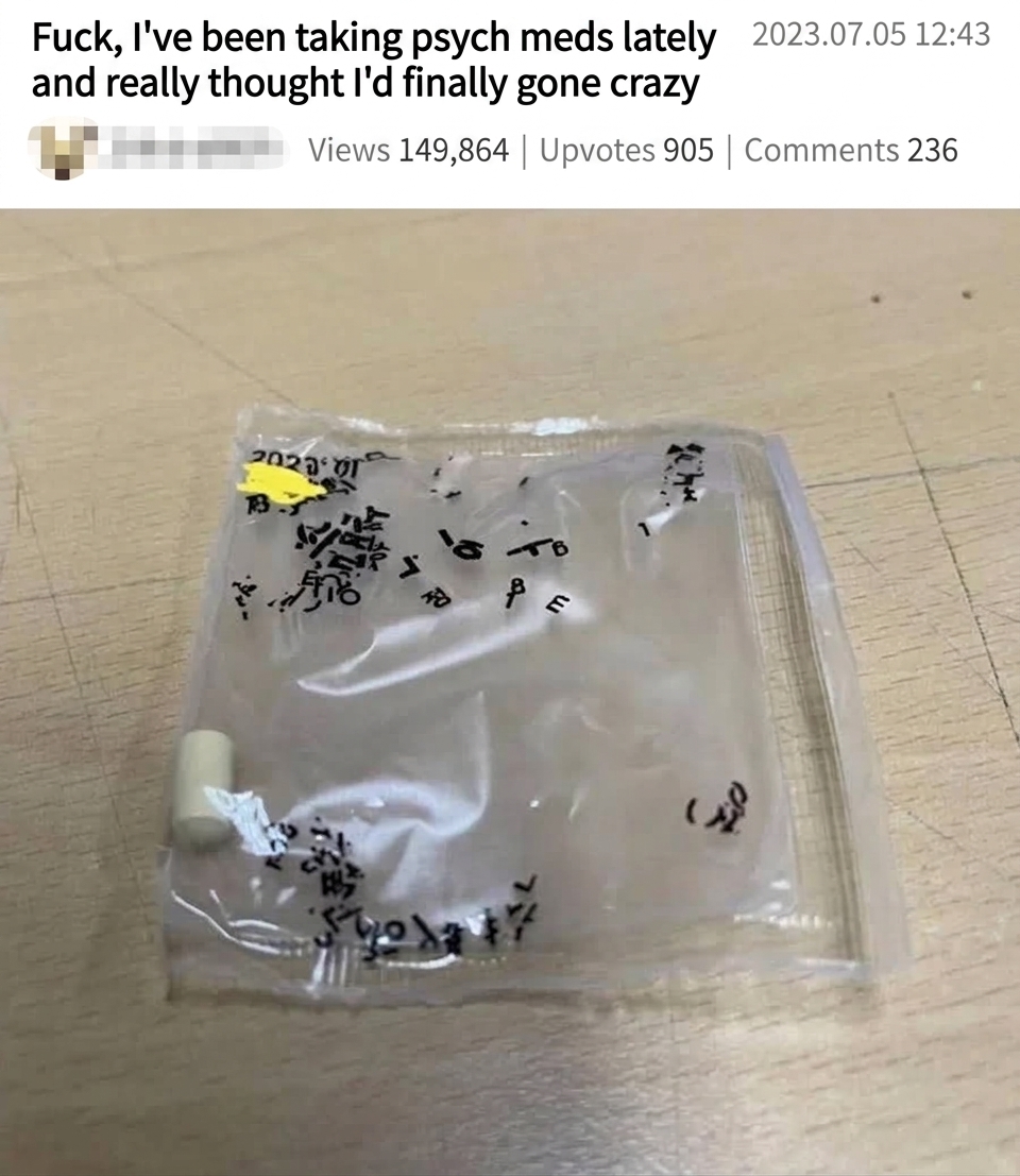 A single pill inside a clear medicine packet where black printed characters have dissolved and scattered everywhere due to sweat