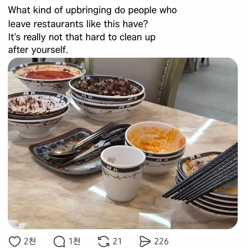 Neatly arranged and stacked empty jjamppong and jajangmyeon bowls, plates, and chopsticks on a Chinese restaurant table
