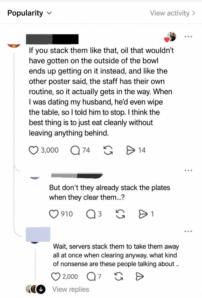 Social media comment screenshot showing a clash of opinions over whether stacking dishes smears grease or if they get stacked anyway when cleared
