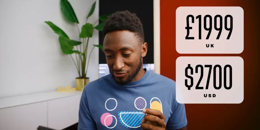 A YouTuber tilting their head slightly next to a graphic showing 1,999 British pounds and its equivalent of 2,700 US dollars